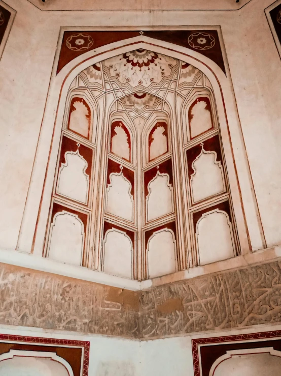 a large window in the middle of a building, a detailed painting, inspired by Osman Hamdi Bey, pexels contest winner, arabesque, red and white marble panels, caligraphy, inside a tomb, thumbnail