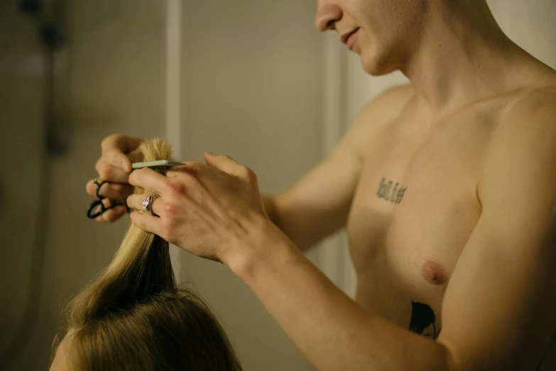 a man cutting a woman's hair with scissors, unsplash, non binary model, low quality photo, body format, lachlan bailey