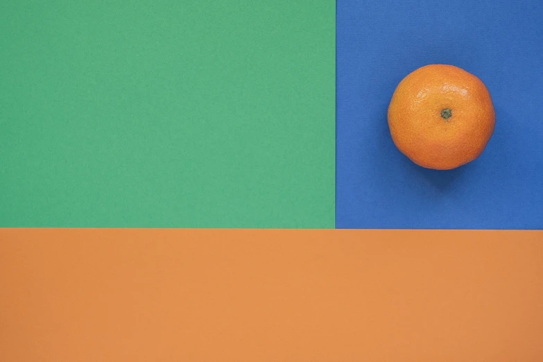 an orange sitting on top of a colorful surface, inspired by Malevich, unsplash contest winner, blue and green colours, helio oiticica, three colors, oranges