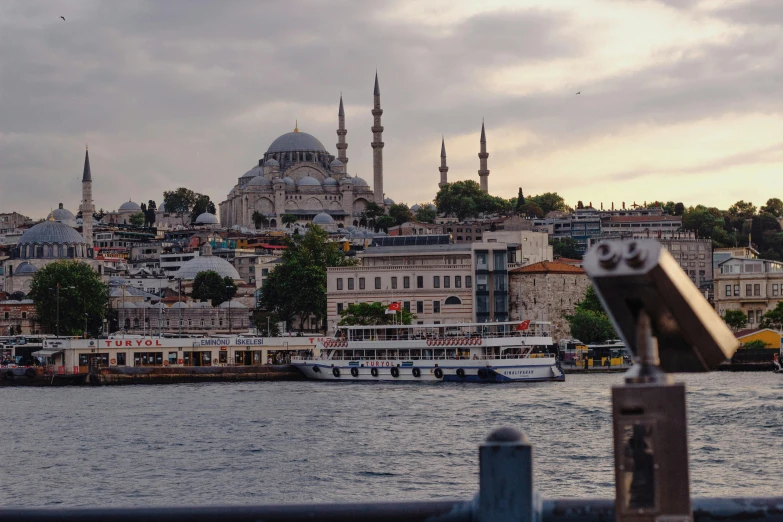 a view of a city from across the water, a colorized photo, pexels contest winner, hurufiyya, turkish and russian, grayish, 🚿🗝📝