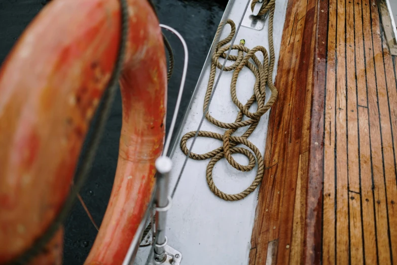 a close up of a rope on a boat, a picture, by Jessie Algie, pexels contest winner, 1960s color photograph, a wooden, thumbnail, ignant