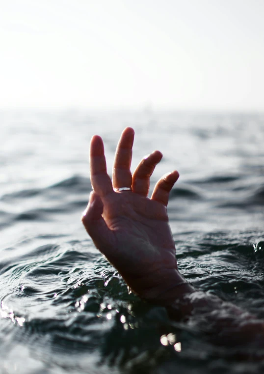 a person's hand reaching out of the water, an album cover, unsplash, distraught, crimes, sirens, 15081959 21121991 01012000 4k