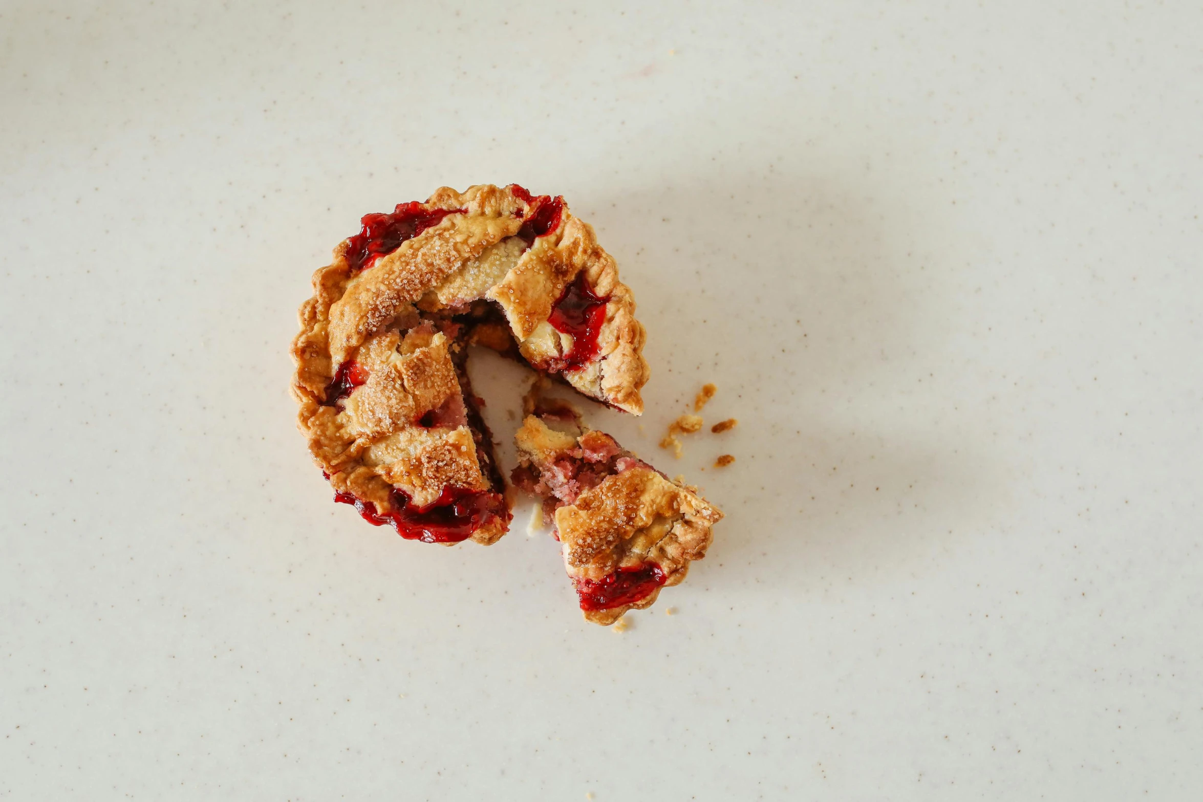 a piece of pie with a bite taken out of it, inspired by Richmond Barthé, unsplash, red, 3 - piece, product view, reverse