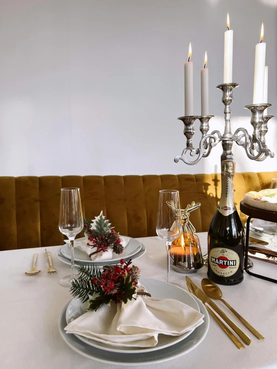 a white table topped with plates and silverware, champagne, thumbnail, cosy atmoshpere, unedited