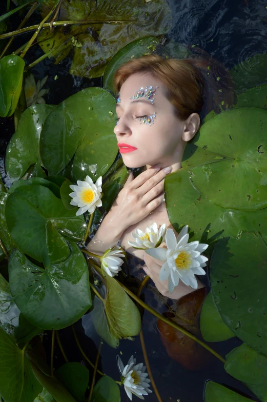 a woman in a body of water surrounded by waterlilies, inspired by Elsa Bleda, white irises and dark eye makeup, synthetic bio skin, instagram photo, ukraine. photography