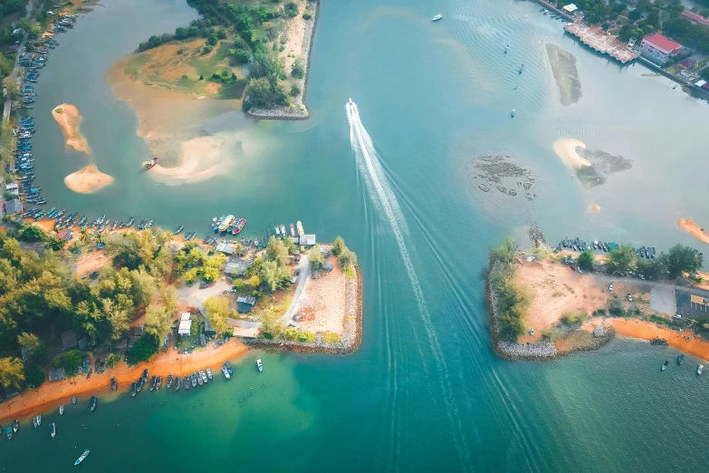 an aerial view of a large body of water, pexels contest winner, bucklebury ferry, tropical island, fishing village, smokey water scenery