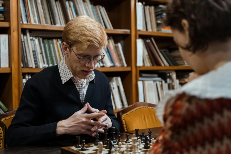 a man and a woman playing a game of chess, reddit, danube school, portrait tilda swinton, in a library, shot with sony alpha, sophia lillis