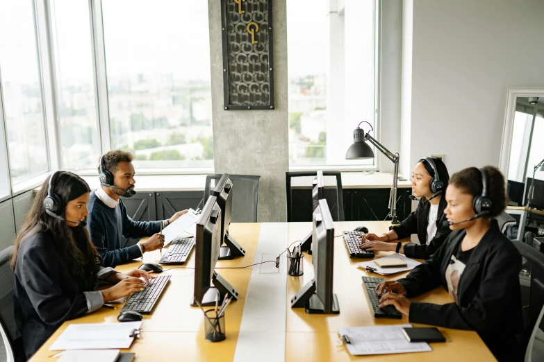 a group of people sitting at a table with computers, trending on pexels, hurufiyya, working in a call center, thumbnail, profile image, 9 9 designs