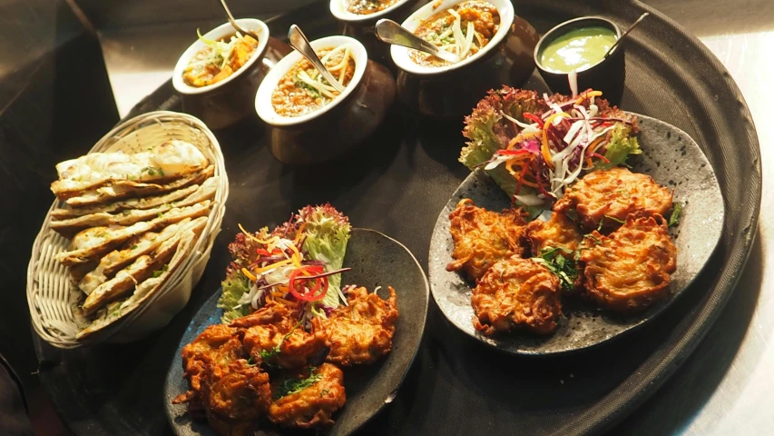 a tray of food sitting on top of a table, hurufiyya, vibrant atmosphere, mesmerising, very crispy, teaser