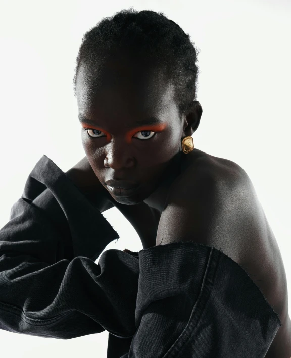 a close up of a person wearing a jacket, inspired by Theo Constanté, trending on pexels, afrofuturism, adut akech, sassy pose, queer woman, album cover