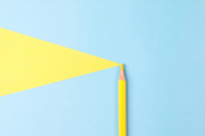 a pencil next to a yellow triangle on a blue background, inspired by Ellsworth Kelly, trending on pexels, postminimalism, yellow awning, instagram post, playful creativity, vexillology