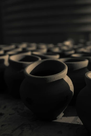 a group of vases sitting on top of a table, by Han Gan, unsplash, process art, assam tea village background, black, made of clay, full frame image