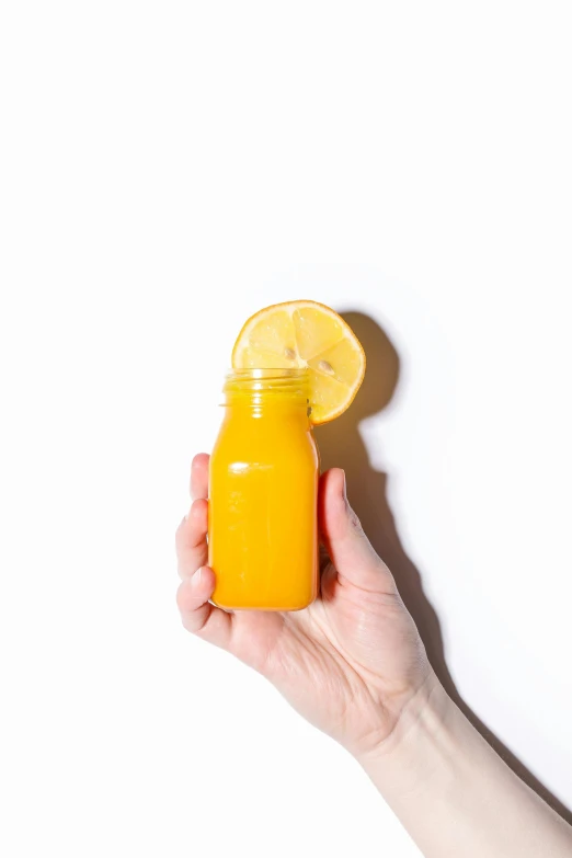 a person holding a glass of orange juice, unsplash transparent, set against a white background, bottle, laura watson