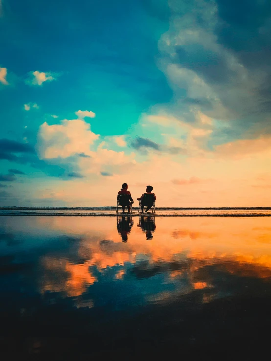 two people riding motorcycles on a beach at sunset, by Jan Tengnagel, pexels contest winner, romanticism, sitting on a reflective pool, colorfull sky, comforting, transparent background