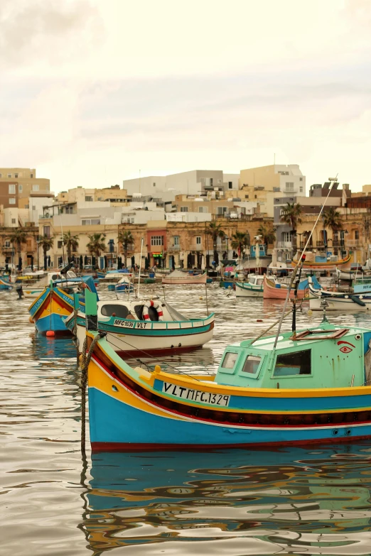 a group of boats floating on top of a body of water, a photo, pexels contest winner, renaissance, mediterranean fisher village, slide show, square, vibrantly colored