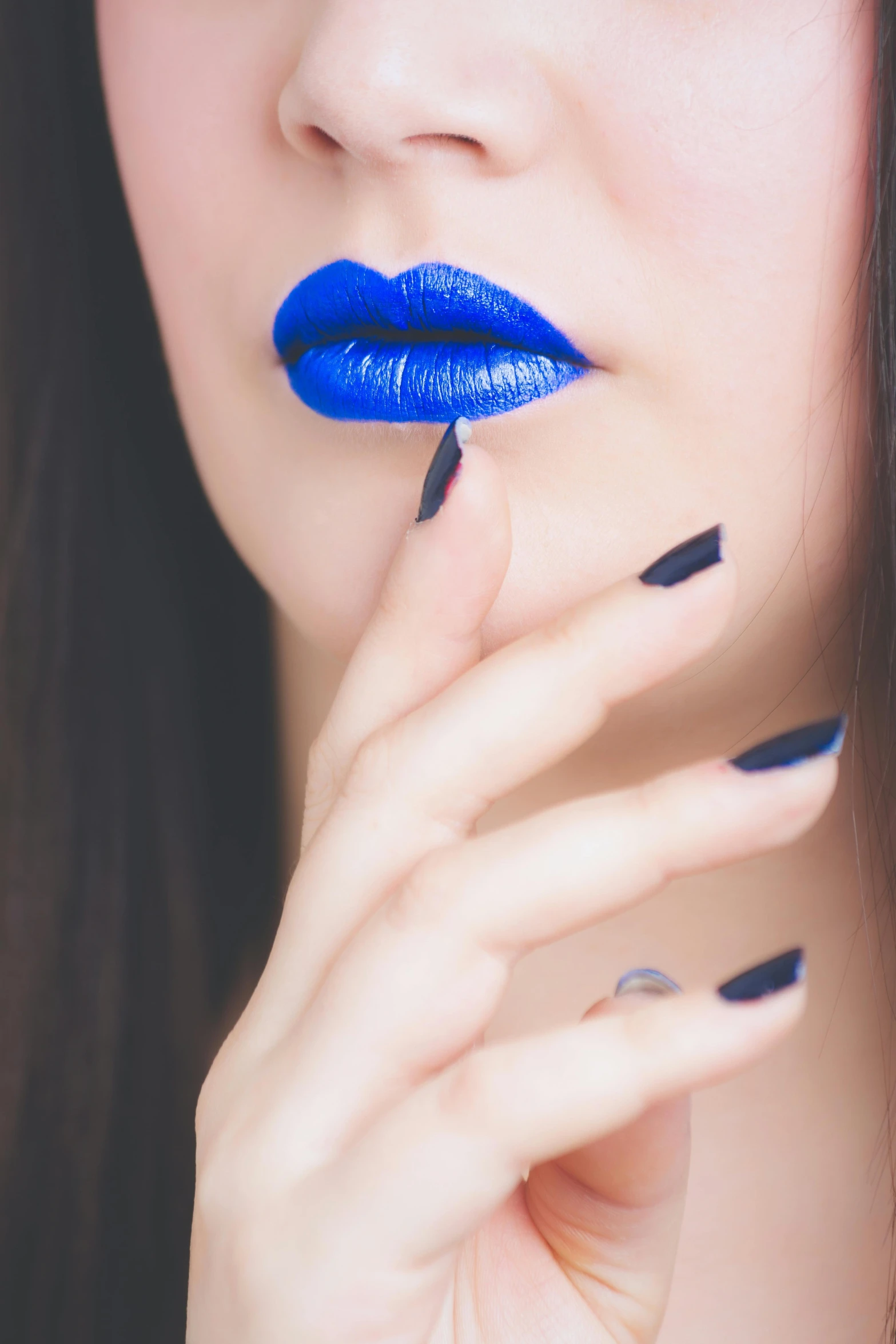 a close up of a person with blue lipstick, inspired by Yves Klein, trending on pexels, aestheticism, long nails, pouting, ilustration, kiss
