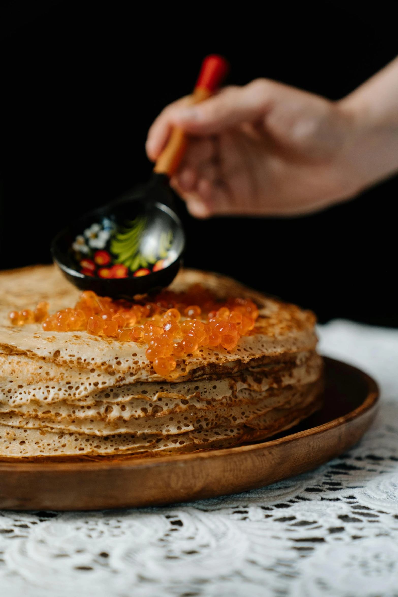 a close up of a plate of food on a table, by Julia Pishtar, russia, pancakes, cake in hand, thumbnail