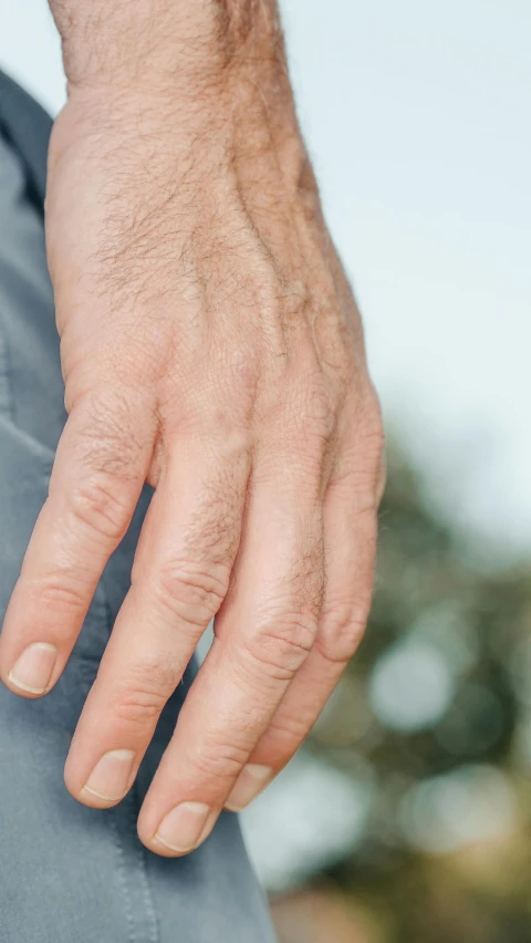 a close up of a person's hand on a skateboard, by Carey Morris, bulging veins, photo of a 50-year-old white man, 15081959 21121991 01012000 4k, synthetic bio skin