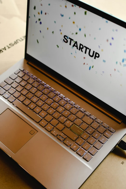 a laptop computer sitting on top of a wooden table, by Daniel Lieske, pexels, starship, a labeled, ai startup, brown