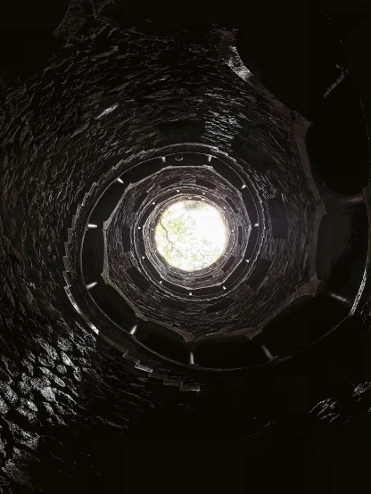 a dark tunnel with a light at the end, unsplash contest winner, flooded ancient tower, ((fish eye)), spiral, thirst