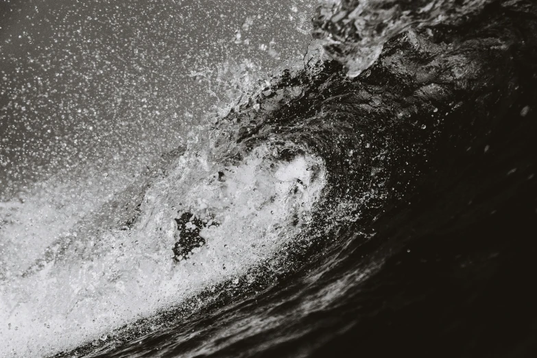 a man riding a wave on top of a surfboard, a black and white photo, unsplash, realism, wave of water particles, highly detailded', hasselblad photo, album