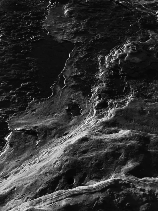 a black and white photo of a person on a surfboard, a microscopic photo, by Andor Basch, terraforming jezero crater, oil like flowing, 4 k detail, break of dawn on pluto