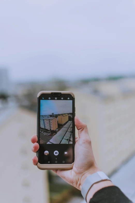 a person taking a picture with their cell phone, a picture, pexels contest winner, rooftop, straight camera view, tall, slightly pixelated