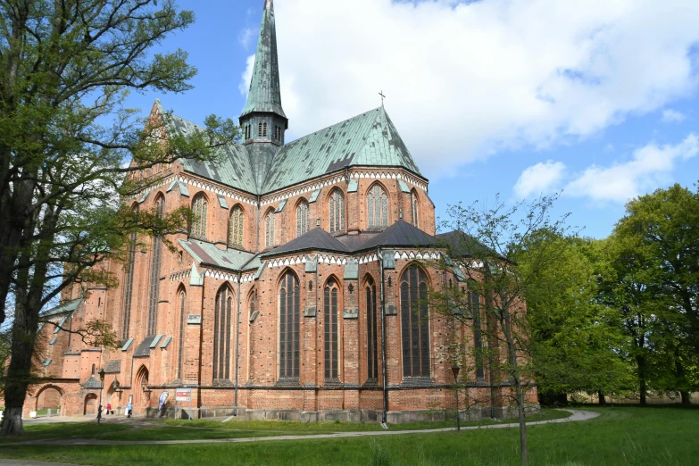 a large brick building with a steeple on top of it, by Harry Haenigsen, pexels contest winner, romanesque, alvar aalto, church in the wood, thumbnail, berkerk