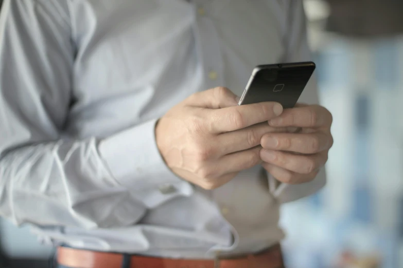 a close up of a person holding a cell phone, pexels, avatar image, 15081959 21121991 01012000 4k, people at work, modeled