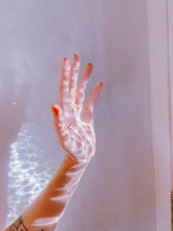a person standing in front of a mirror with their hands in the air, inspired by Elsa Bleda, trending on pexels, holography, glowing veins of white, translucent gills, 8 0's airbrush aesthetic, transparent jellyfish