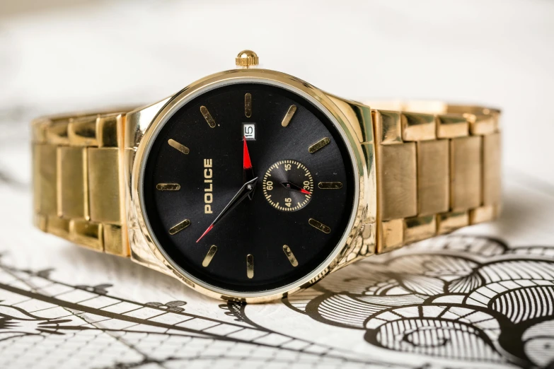 a close up of a watch on a table, pexels contest winner, baroque, accented in bright metallic gold, rogue, red gold black, boch
