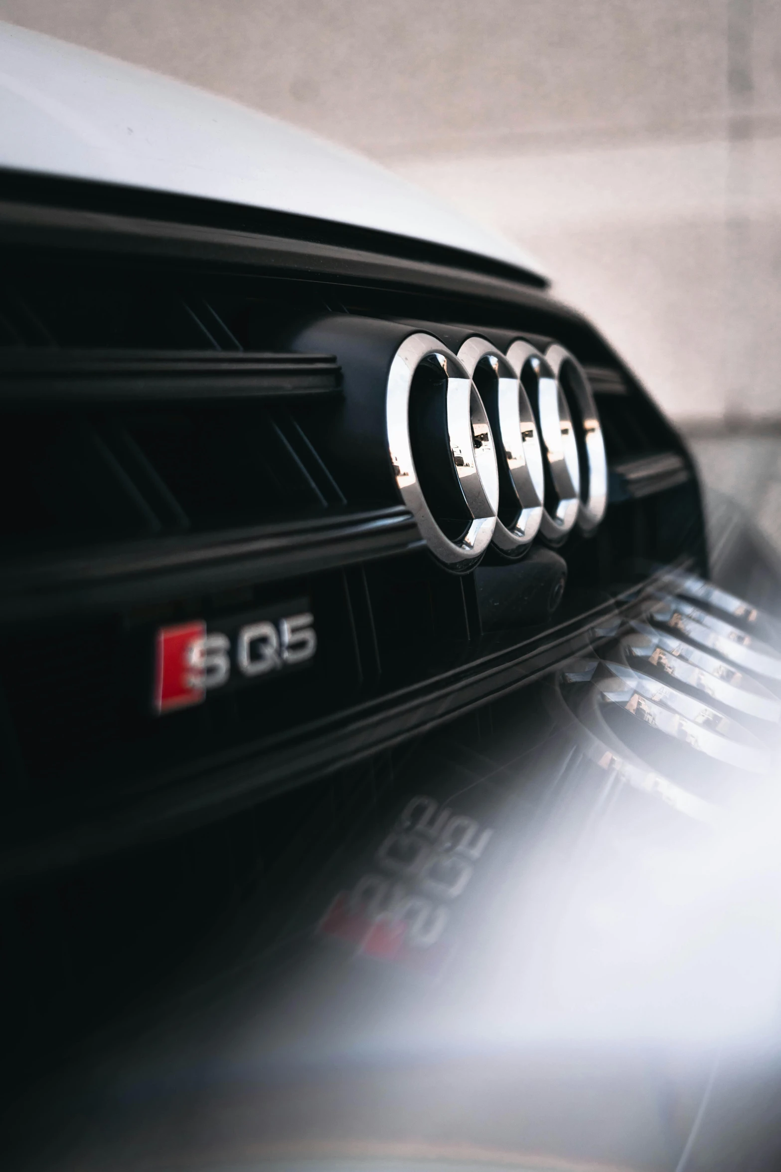 a close up of an audi logo on a car, unsplash, f 5. 8, featuring engine, s line, indoor picture