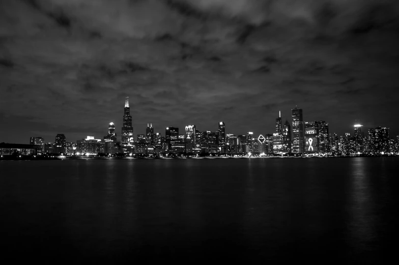 a black and white photo of a city at night, by Greg Rutkowski, pexels contest winner, chicago skyline, overcast dusk, 1024x1024, high quality picture