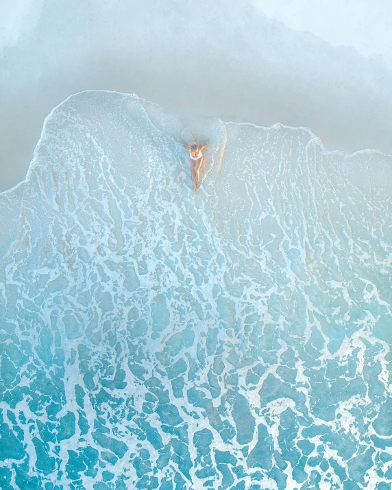 a person laying on a surfboard in the ocean, by Peter Churcher, unsplash contest winner, conceptual art, aerial iridecent veins, white bikini, gold coast australia, spreading her wings