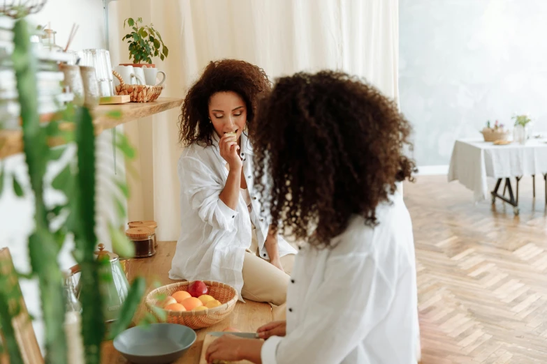 a couple of women sitting on top of a wooden floor, brushes her teeth, breakfast, standing in front of a mirror, profile image