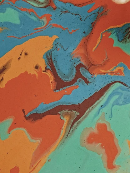 a close up of a piece of art on a table, inspired by Morris Louis Bernstein, trending on unsplash, coloured in teal and orange, chocolate river, marbled swirls, by greg rutkowski