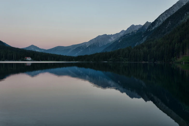 a body of water with mountains in the background, by Otto Meyer-Amden, pexels contest winner, calm evening, mirror lake, where a large