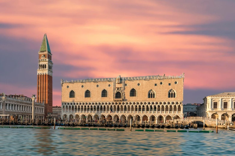 a large building sitting next to a body of water, inspired by Quirizio di Giovanni da Murano, pexels contest winner, renaissance, pink golden hour, square, panoramic, turquoise and venetian red