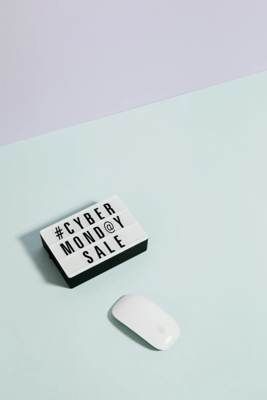 a computer mouse sitting on top of a desk, a poster, by Carey Morris, trending on pexels, hypermodernism, square sticker, sales, mint, trendy typography