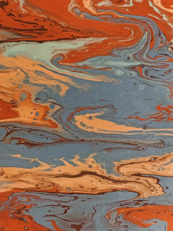 a close up of an orange and blue marbled surface, by Mandy Jurgens, chocolate river, savannah, michael angelo inspired, earthwave