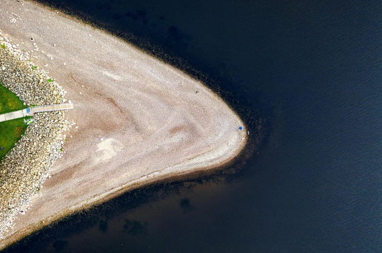 an aerial view of a road next to a body of water, a microscopic photo, inspired by Attila Meszlenyi, trending on unsplash, land art, salt dunes, space ship above an island, bird\'s eye view, ignant