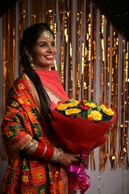 a woman is holding a bouquet of flowers, samikshavad, dressed in a jodhpuri suit, award-winning style, lit up, wearing red and yellow clothes