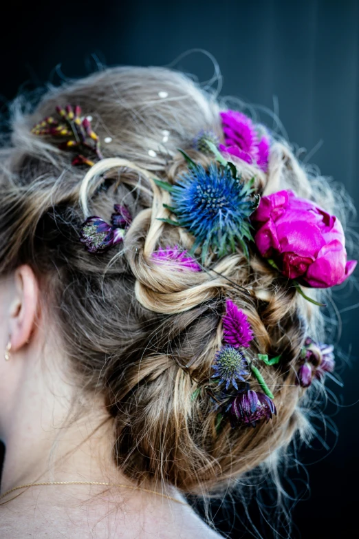 a woman with a flower in her hair, inspired by Floris van Dyck, unsplash, fuchsia and blue, thistle, updo, intricate details. front on