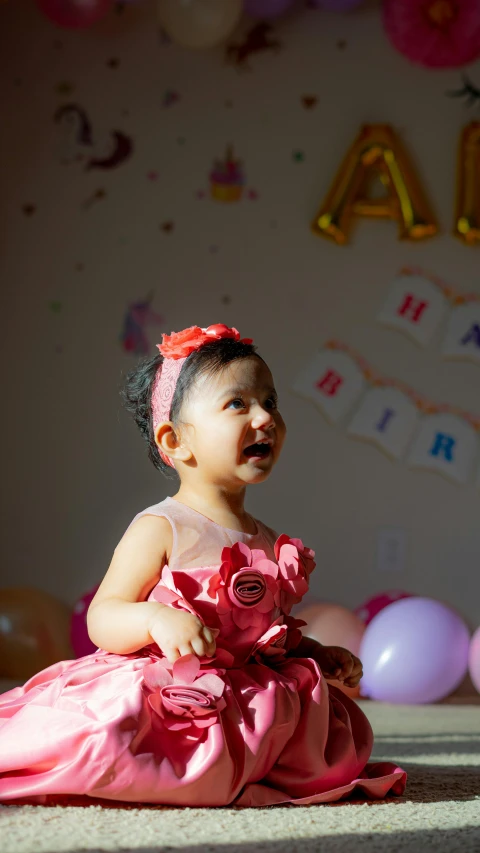 a little girl in a pink dress sitting on the floor, by Basuki Abdullah, pexels contest winner, at a birthday party, 15081959 21121991 01012000 4k, excited, gif