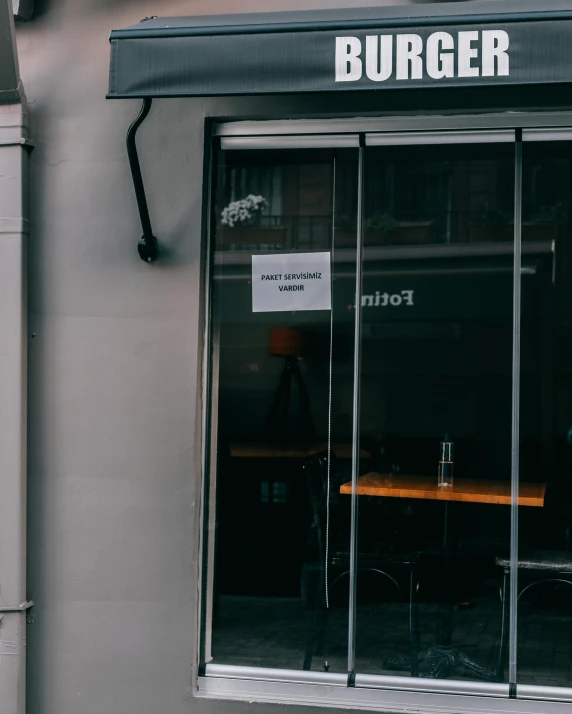 a black and white photo of a burger restaurant, by Tom Bonson, unsplash, art nouveau, the window is open, drunkard, but minimalist, burka