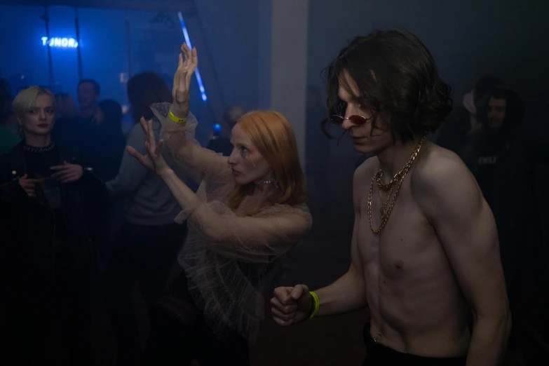 a man and a woman dancing at a party, an album cover, inspired by Nan Goldin, pexels, renaissance, declan mckenna, ville valo, acid house, movie still 8 k