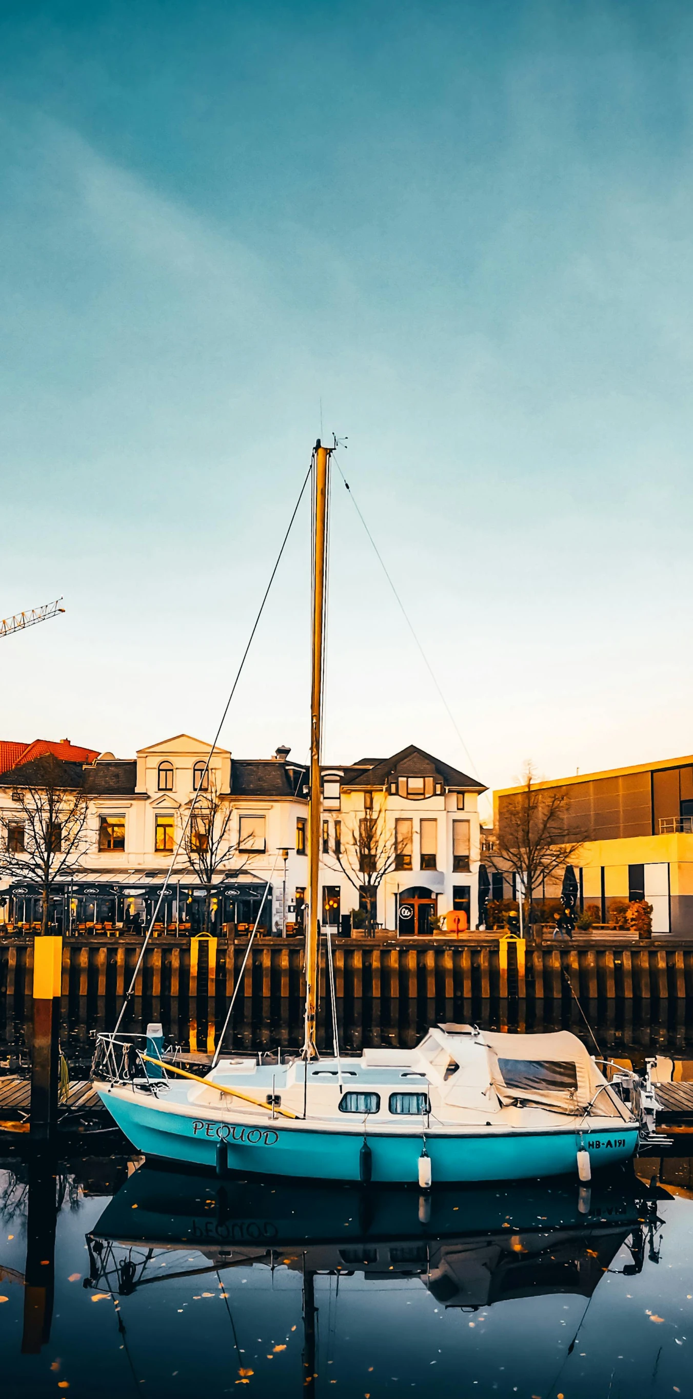 a boat that is sitting in the water, by Jan Tengnagel, unsplash, hurufiyya, town background, three masts, thumbnail, low quality photo