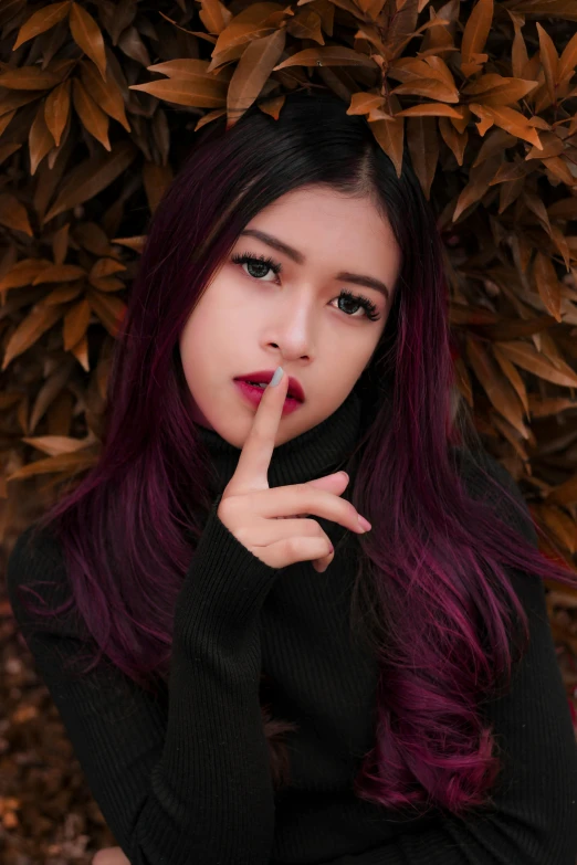 a close up of a person with a finger on their lips, a picture, inspired by Elsa Bleda, trending on pexels, anime thai girl, purple long hair, top secret style photo, square nose