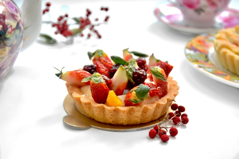 a close up of a plate of food on a table, berries, profile image, pastry, decoration