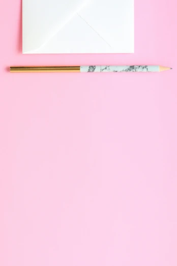 a white envelope and a pencil on a pink background, trending on pexels, marble and gold, headshot profile picture, !pencil, set photo